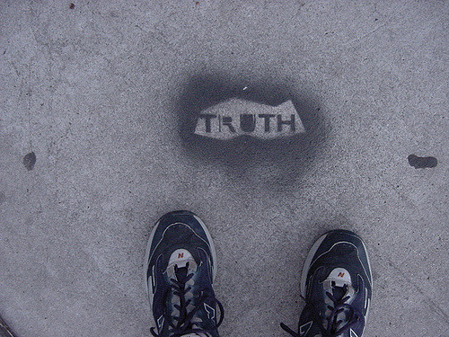 Stencil of the word truth on the sidewalk
